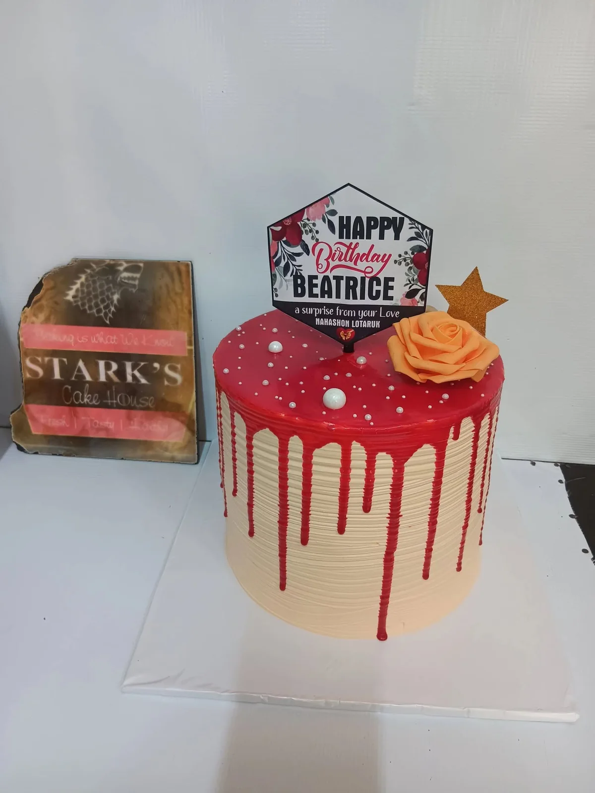 Red drip birthday cake by Stark’s Cake House in Turkana