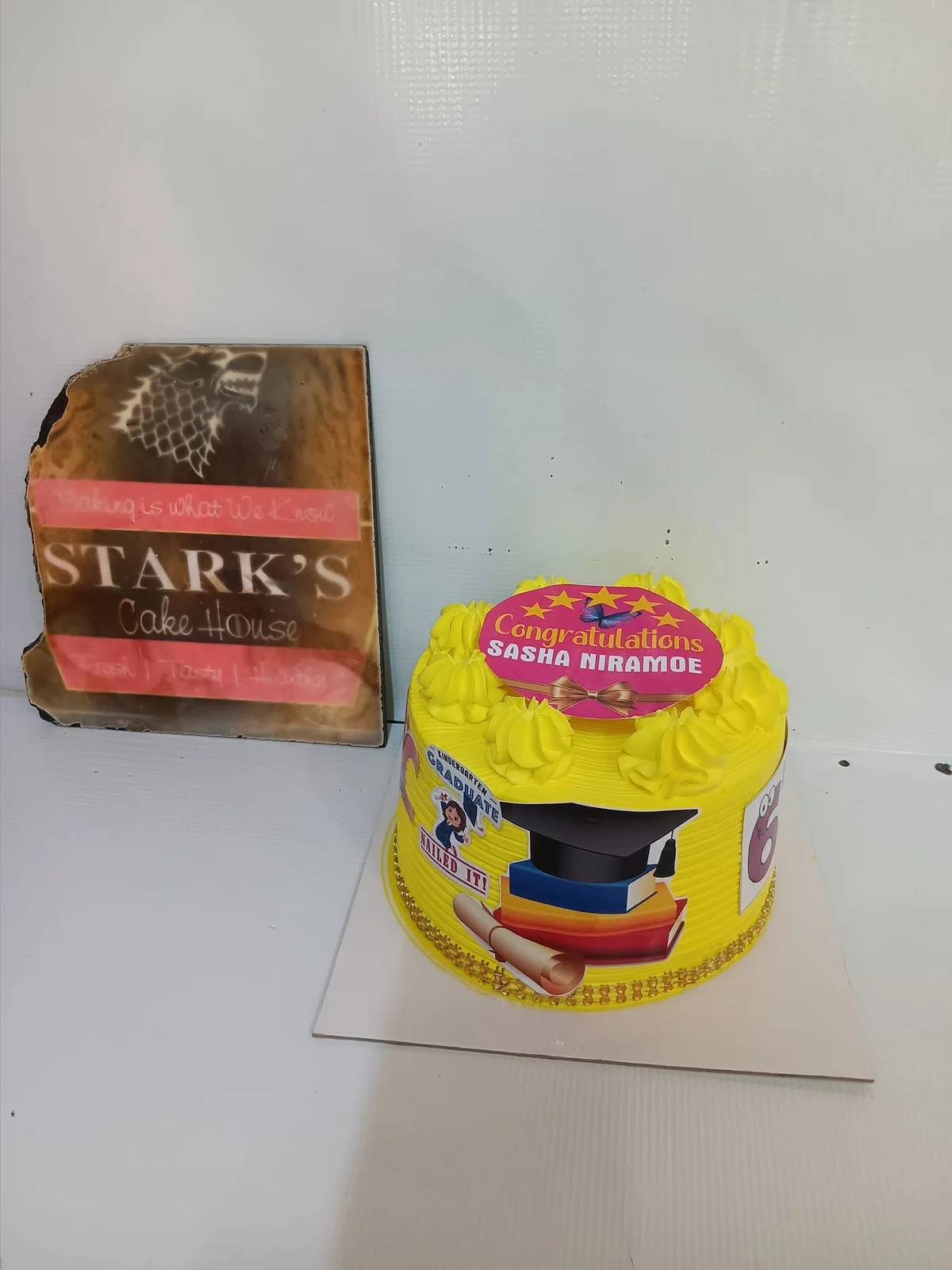 Yellow graduation cake by Stark’s Cake House in Turkana