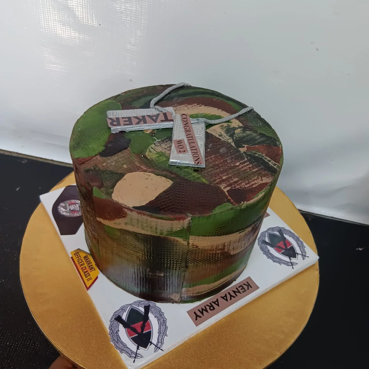 Uniform themed square celebration cake by Stark’s Cake House in Turkana