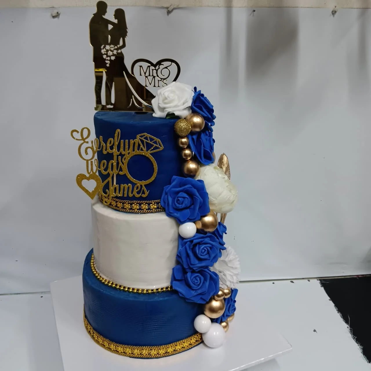 Blue and gold wedding cake by Stark’s Cake House in Turkana